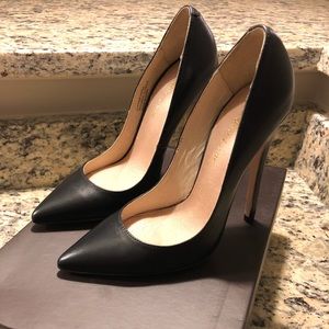 Black leather pointed toe heels